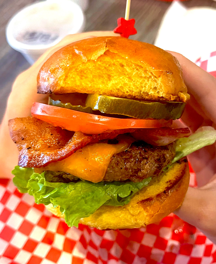 Quig's burger with toppings